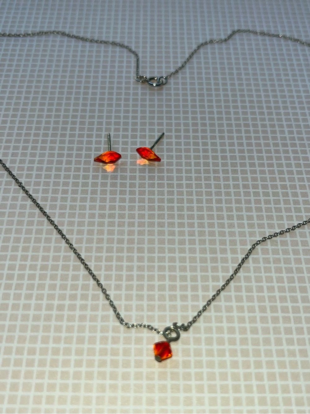 Swarovski crystal stud earrings with matching silver necklace